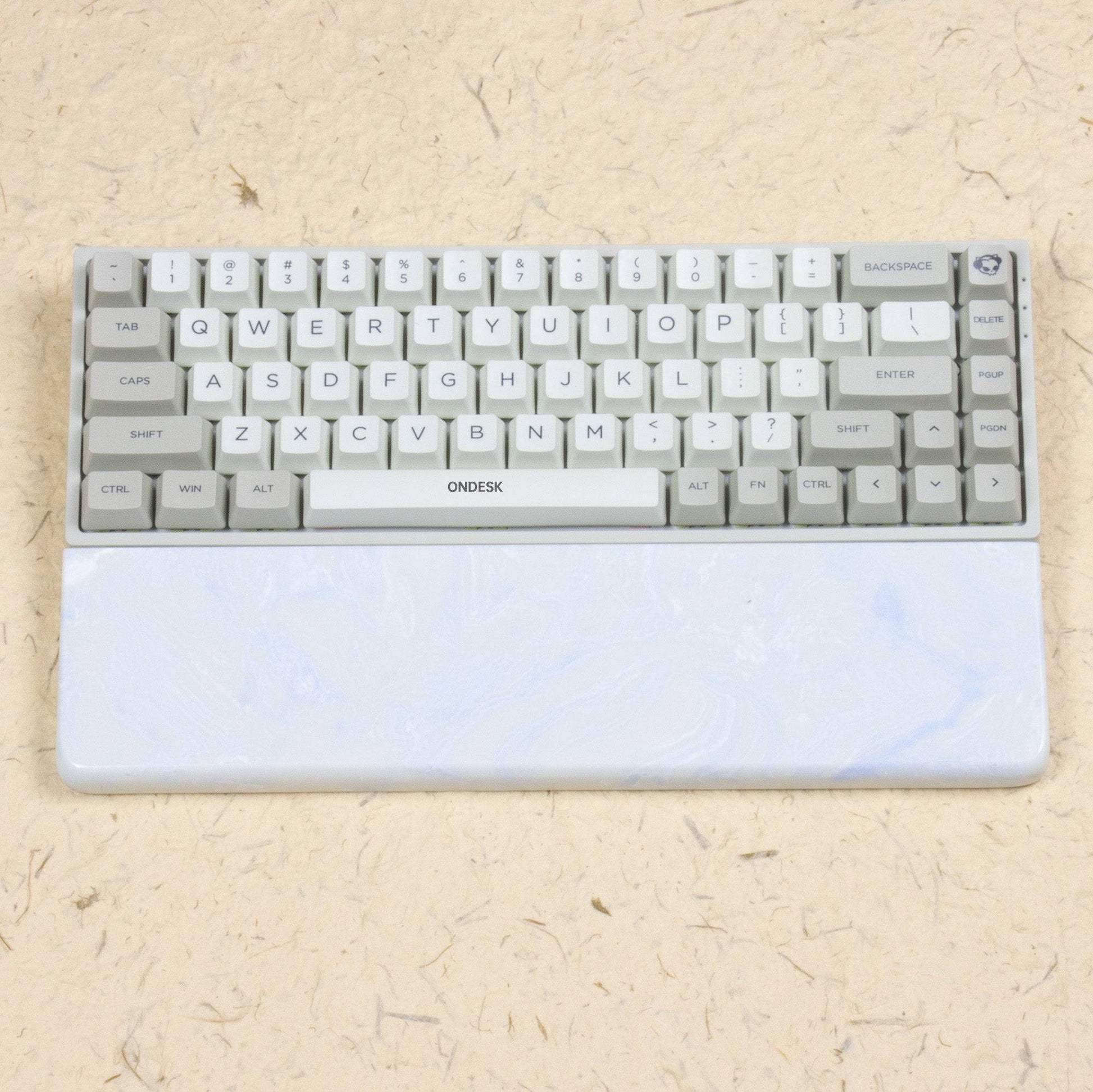 White and blue wrist rest with keyboard