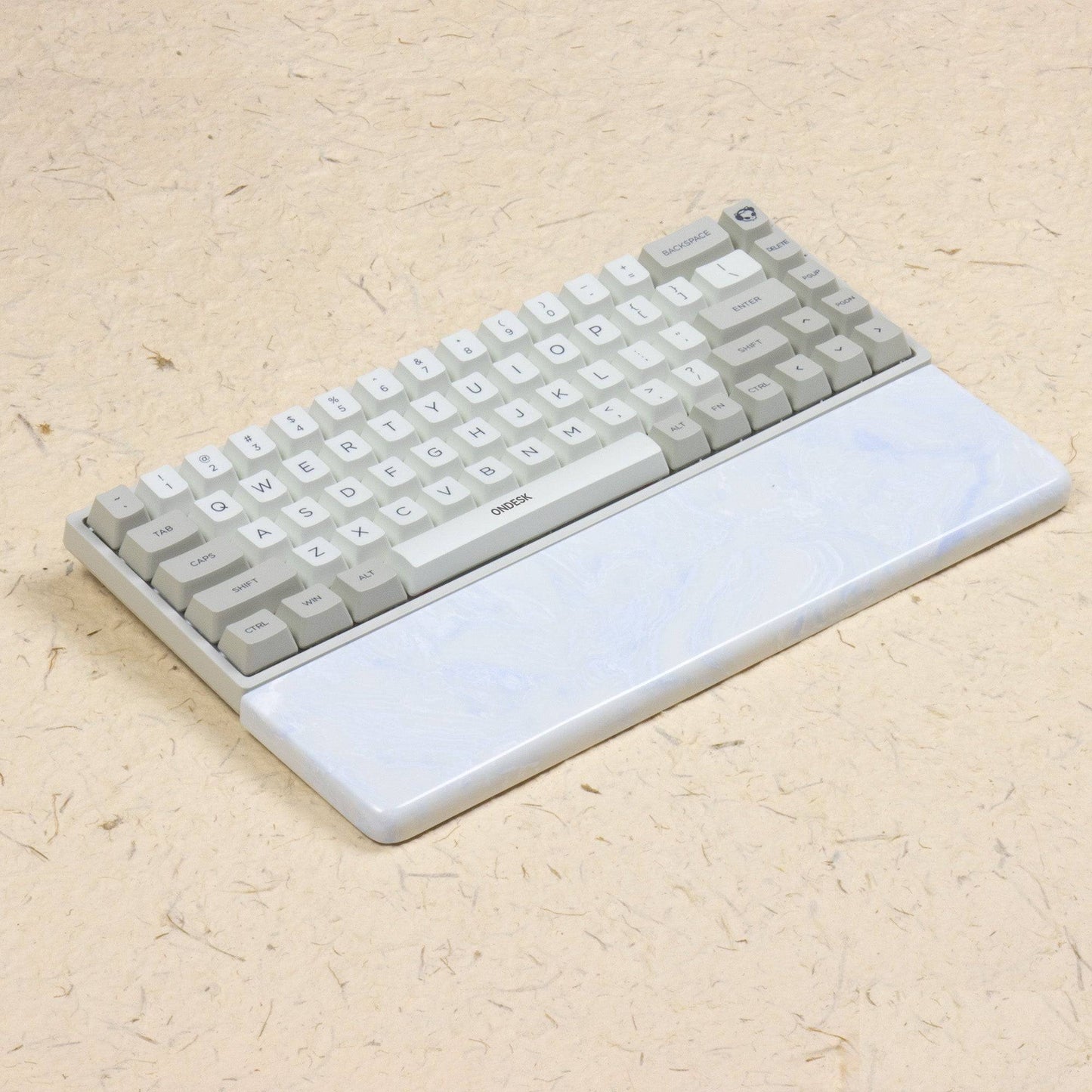 White and blue wrist rest with keyboard