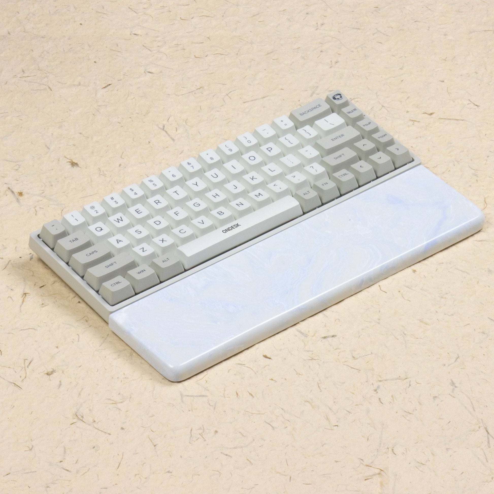 White and blue wrist rest with keyboard