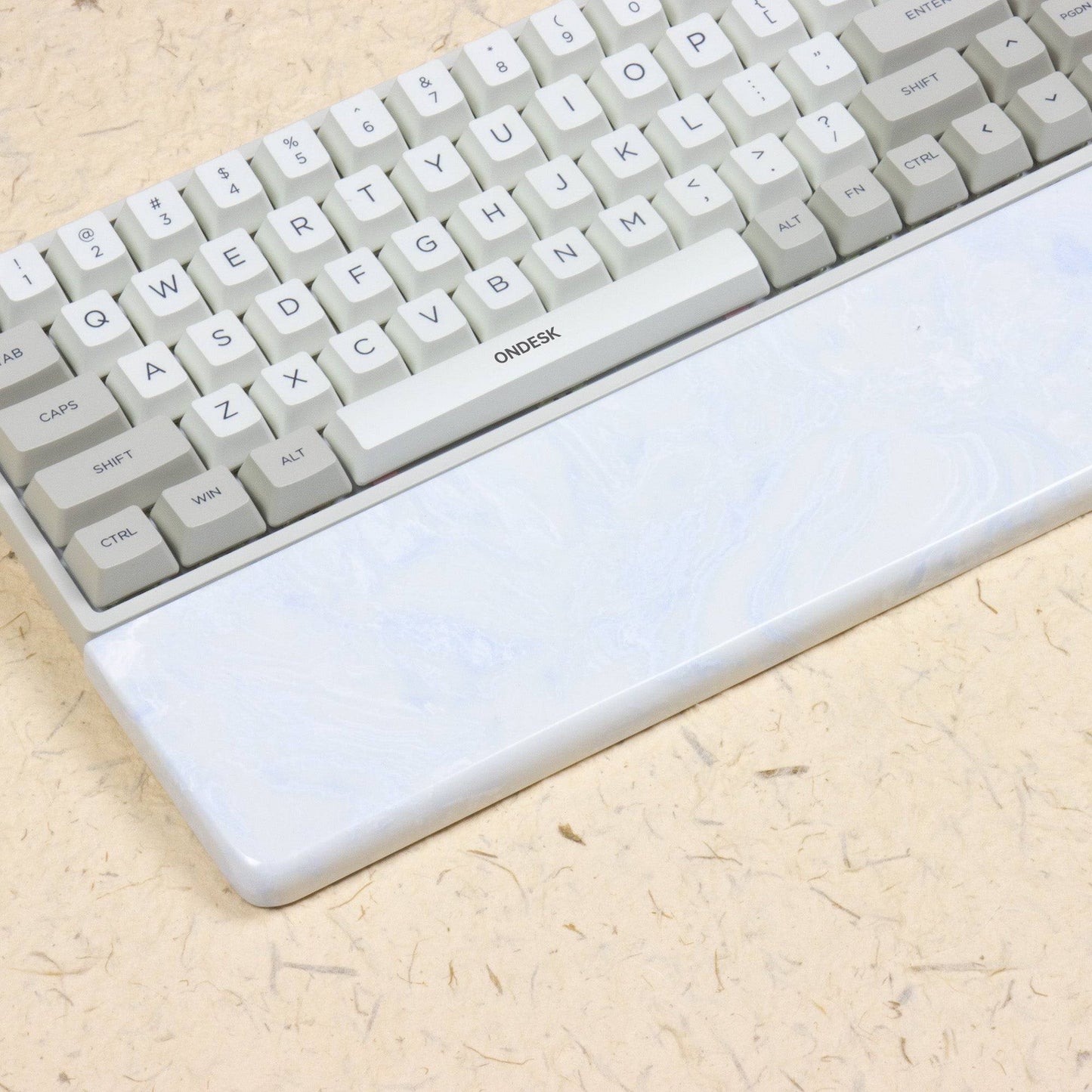 White and blue wrist rest with keyboard