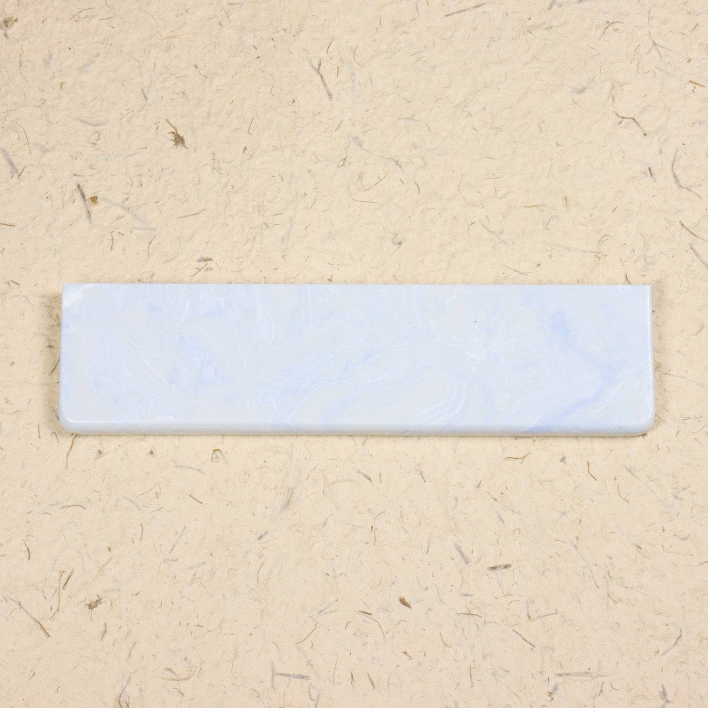 White and blue wrist rest