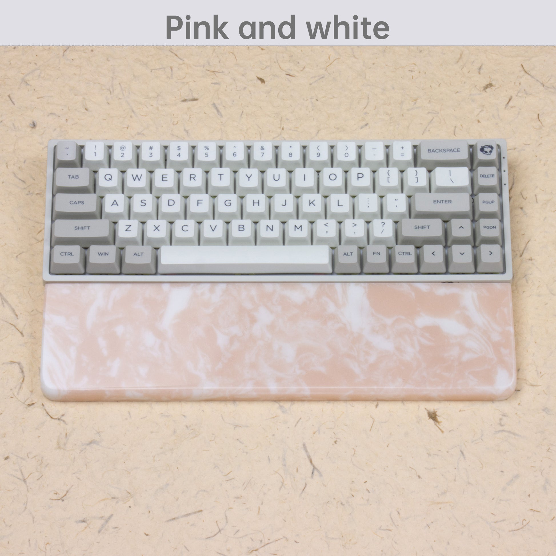 Pink resin wrist rest with keyboards