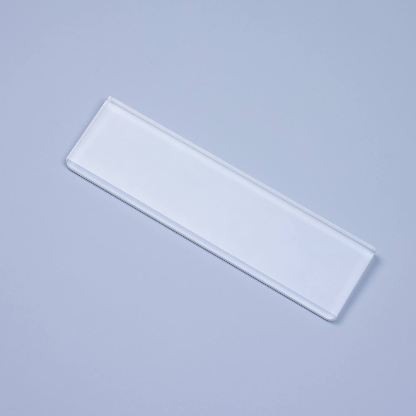 Frosted Crystal Wrist Rest overhead light on blue background