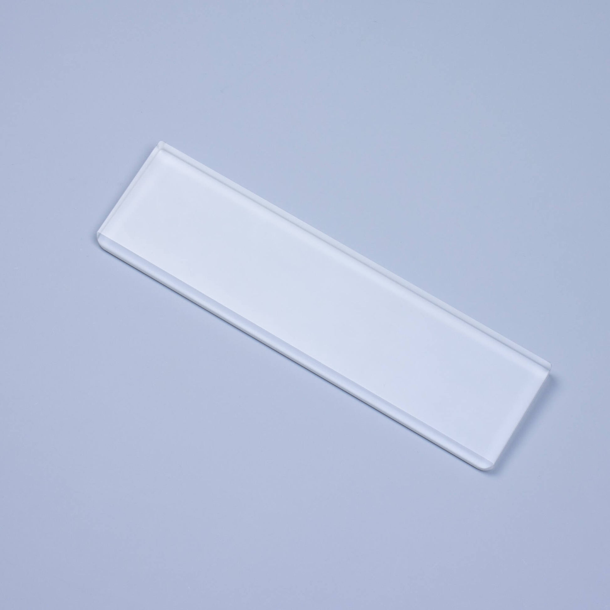 Frosted Crystal Wrist Rest overhead light on blue background