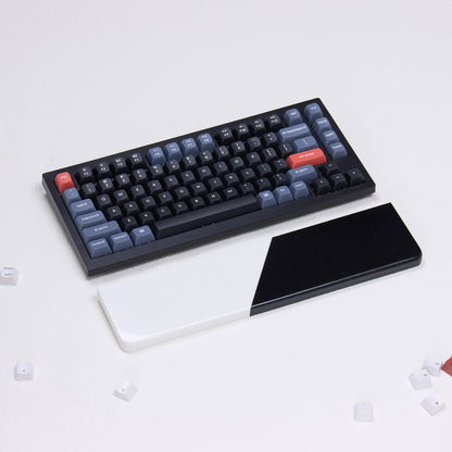 Angled profile of yeswristrest Pure Dual-Tone solid black and white diagonal split quartz stone wrist rest