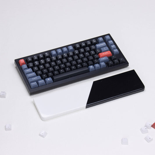 Angled profile of yeswristrest Pure Dual-Tone solid black and white diagonal split quartz stone wrist rest