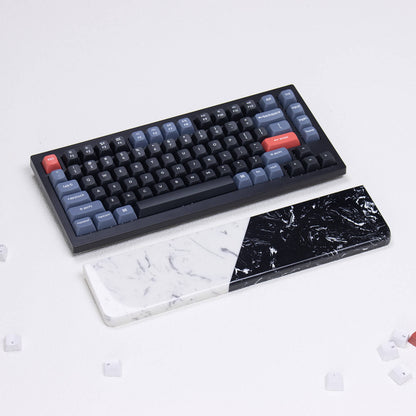 yeswristrest Textured Dual-Tone quartz wrist rest featuring crystalline fracture and marble grain beside mechanical keyboard