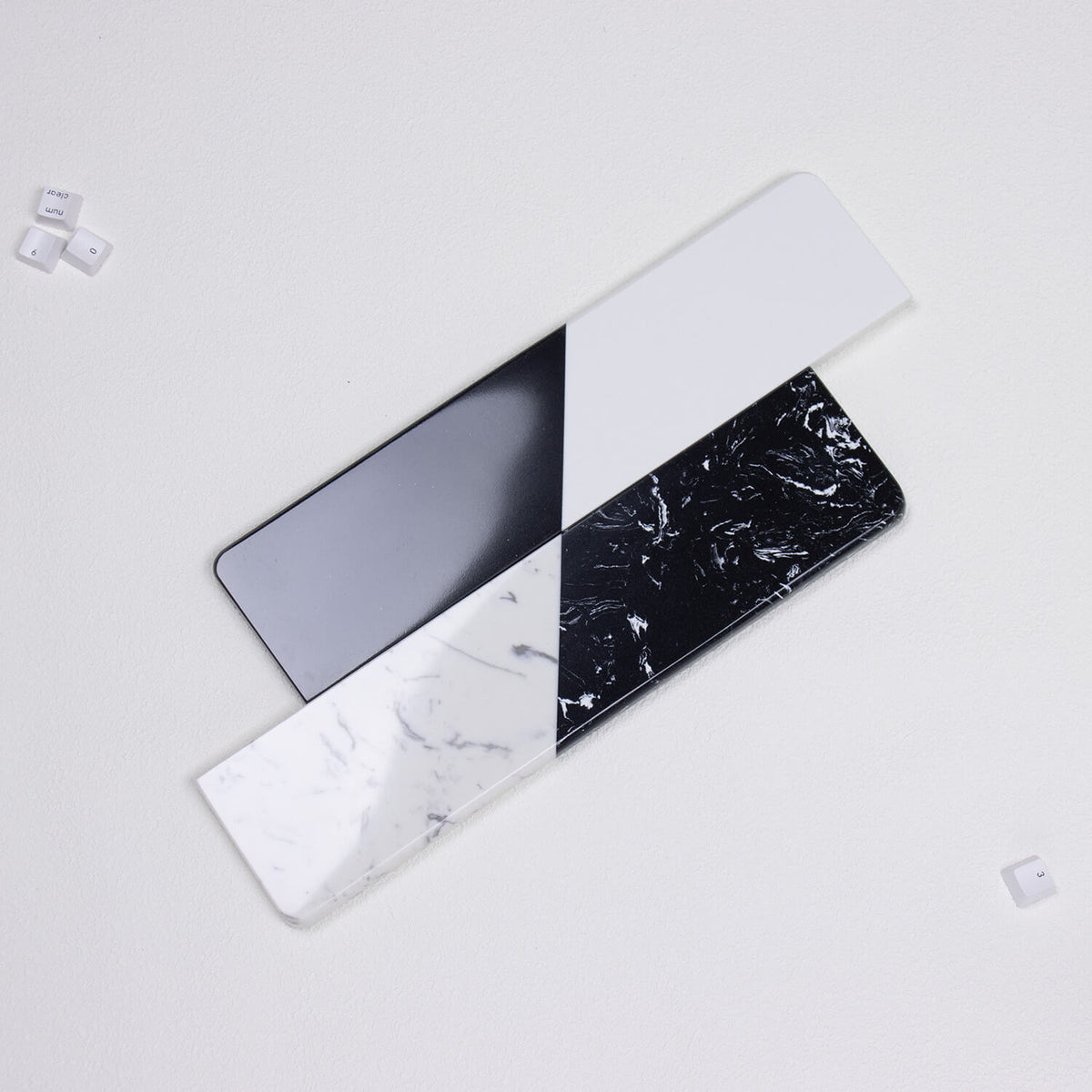 Top-down view comparing smooth solid split and fractured mineral textured quartz stone wrist rests by yeswristrest