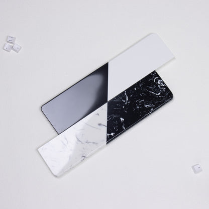 Top-down view comparing smooth solid split and fractured mineral textured quartz stone wrist rests by yeswristrest