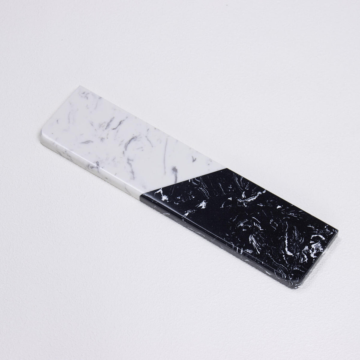 Perspective close-up of Textured Dual-Tone quartz palm rest highlighting beveled edges and cooling stone surface