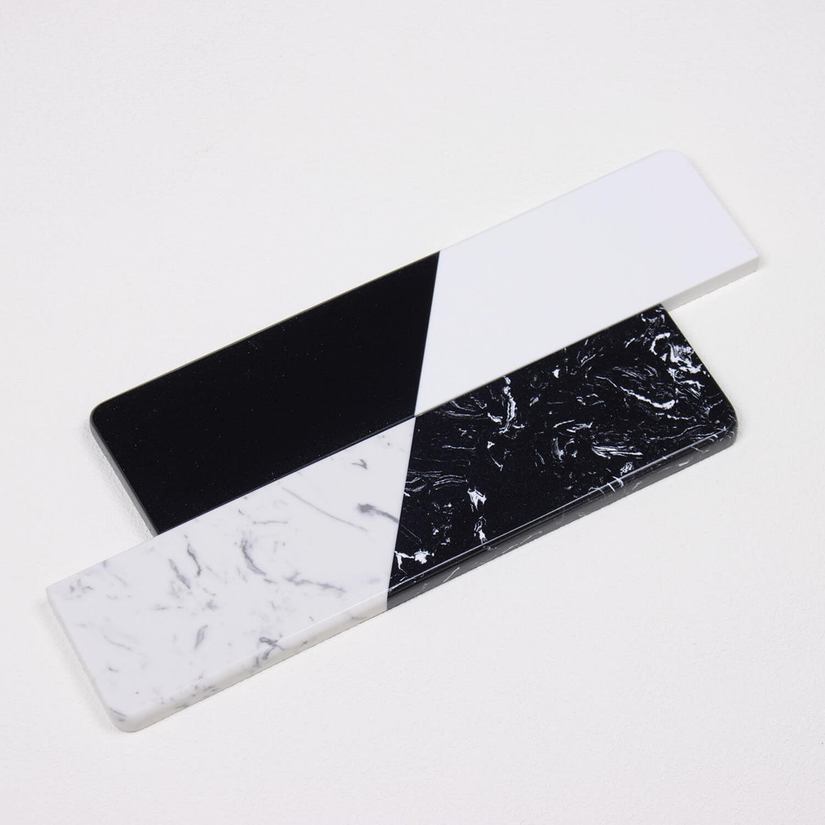 Pure Dual-Tone and Textured Dual-Tone quartz wrist rests stacked in an X-cross pattern showing finish differences