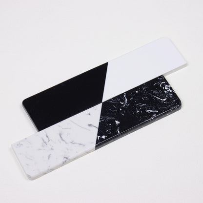 Pure Dual-Tone and Textured Dual-Tone quartz wrist rests stacked in an X-cross pattern showing finish differences