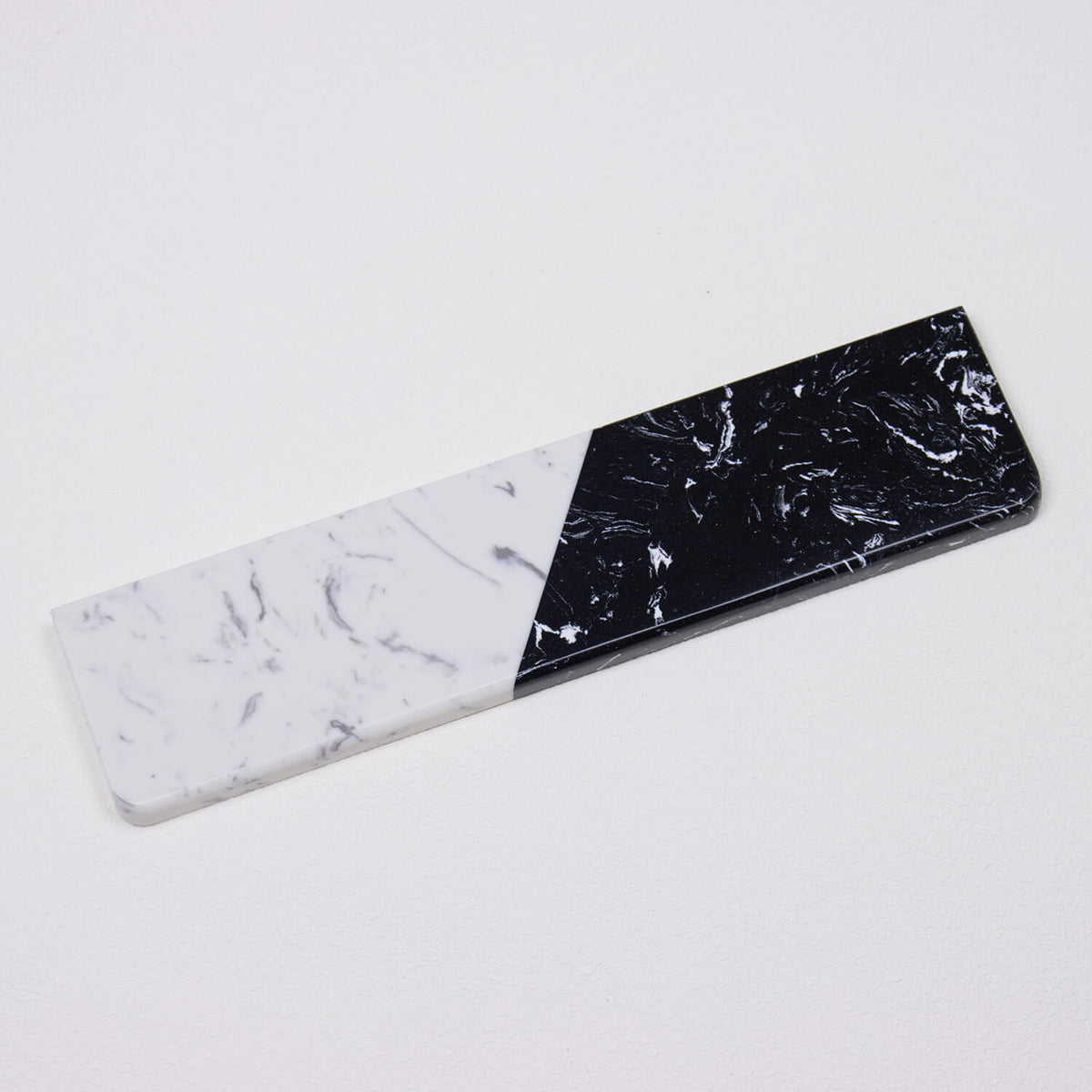 Full isolated perspective view of Textured Dual-Tone quartz wrist rest highlighting crystalline black and white patterns