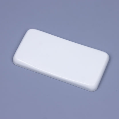 Angled close-up of a minimalist solid pure white quartz mouse wrist rest showing sleek polished chamfered edges and ergonomic sloped contour